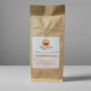 A brown paper bag of "Great Mornings Coffee & Tea" brand's Chocolate Strawberry Coffee. The label indicates it is a drip grind with a net weight of 8 oz (227g), and the website is www.greatmorningscoffeeandtea.com